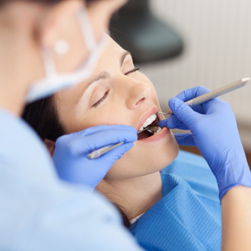 Woman relaxing during dental work thanks to sedation dentistry in Norman