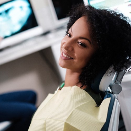 Woman preparing to leave dentist’s office after oral conscious sedation