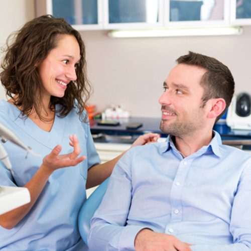 Dentist and patient discussing if oral conscious sedation is right for them